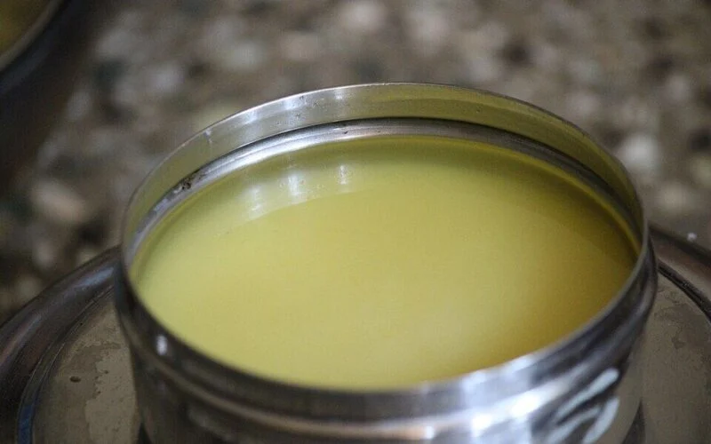 Containers of ghee on a shop shelf during food safety inspections in Delhi