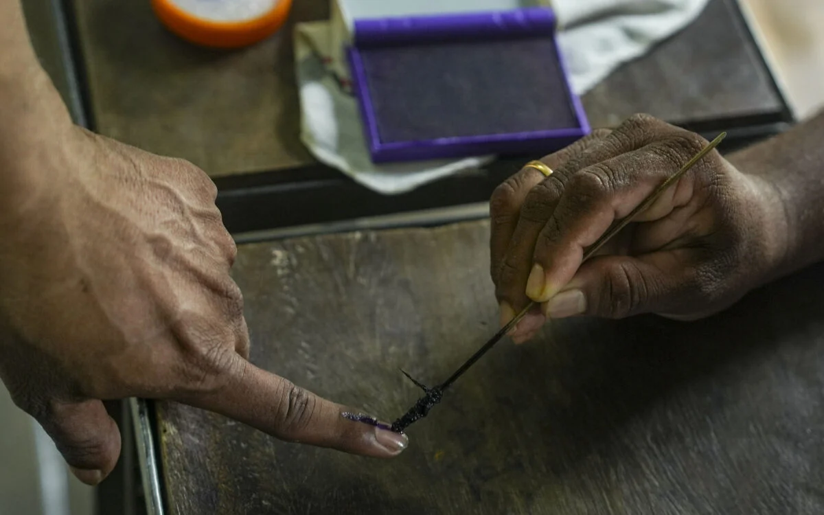 A voter's inked finger at a polling booth during an Indian election