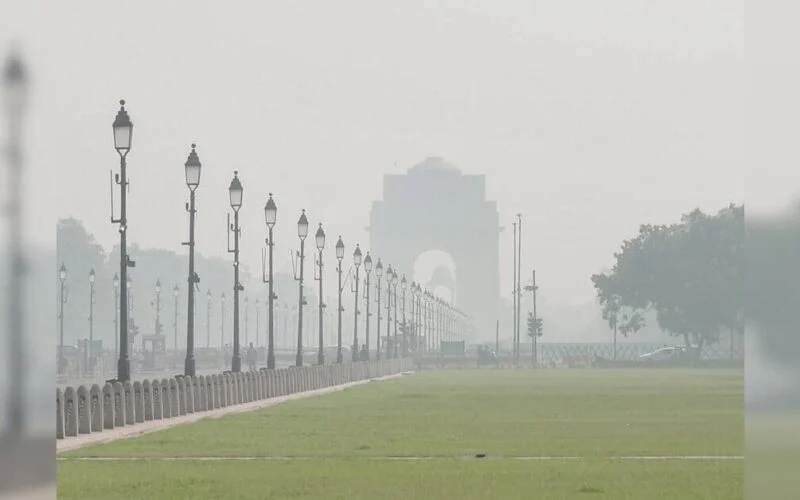 Haze over a Delhi road as air quality hovers near the poor band