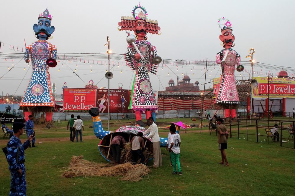 Tall effigies of Ravana and other figures standing at a Dussehra ground in New Delhi