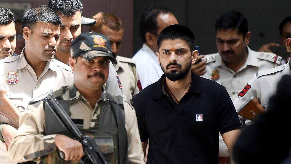 Jailed gangster Lawrence Bishnoi being escorted by police at a Delhi court