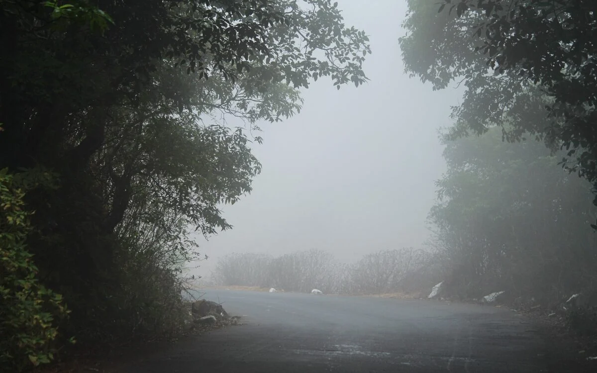 Rain clouds over a green landscape in Maharashtra