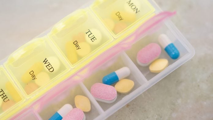 Assorted medicines arranged in a pill organiser in Mumbai