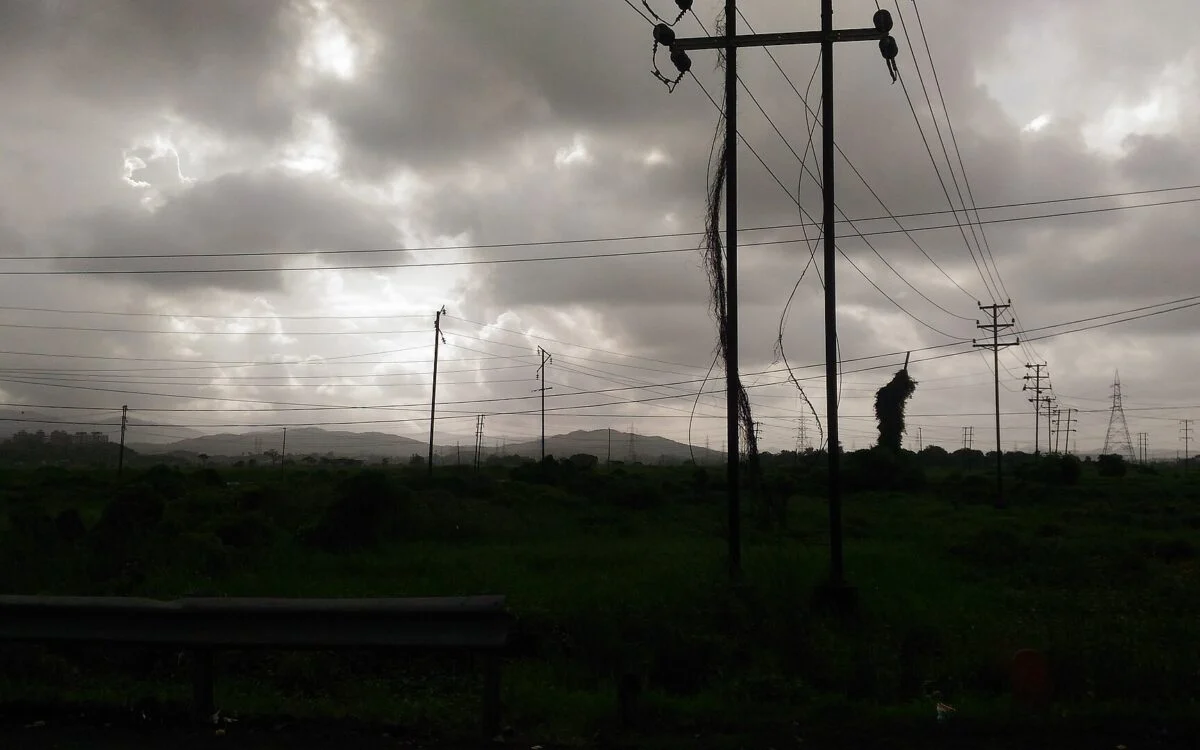 Dark rain clouds gathering over an Indian landscape