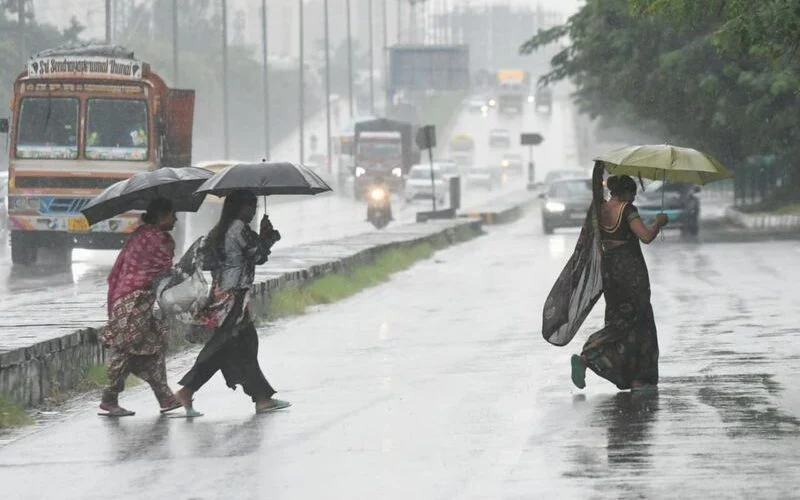 Rain clouds and wet road scene in north India, Tribune file photo