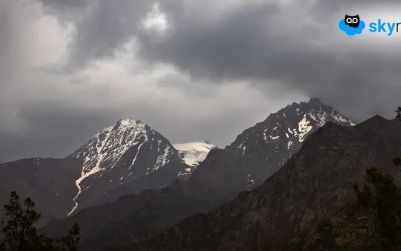 Snowfall over a Himalayan hill area
